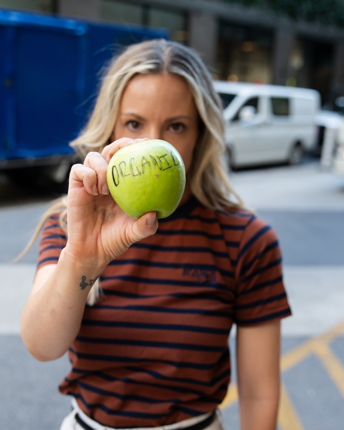 Kath holding an apple during a creative shoot